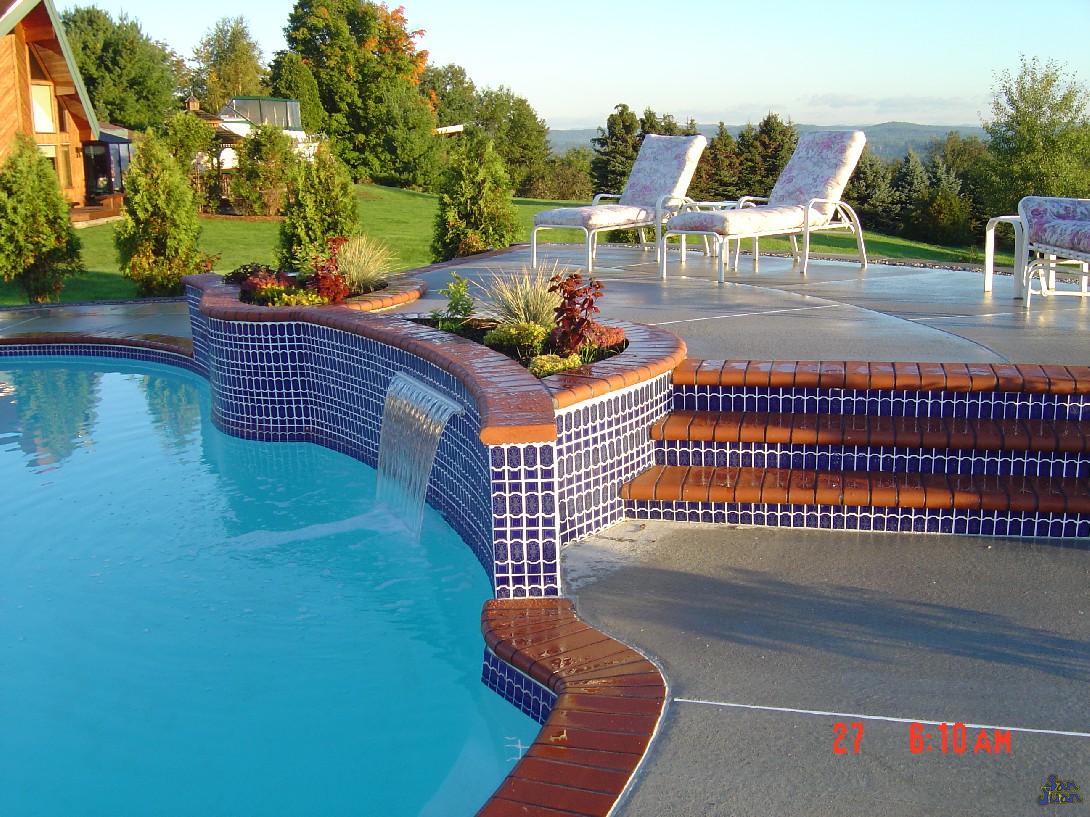 atlantic pool shape with raised decking and tile line