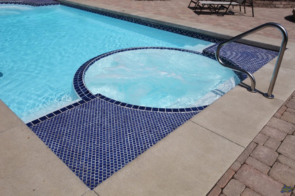 ceasars palace fiberglass pool shape with attached spa steps and handrail