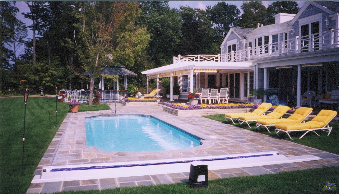 This pool is so popular that it has been around for many years. San Juan Pools is proud to produce it and we are glad to see it. Just take a look at the way it gorgeous sits in this concrete deck next to the white raised pergola. This quaint home almost looks like it came out of a magazine. Are you ready for your home to look like this as well? 