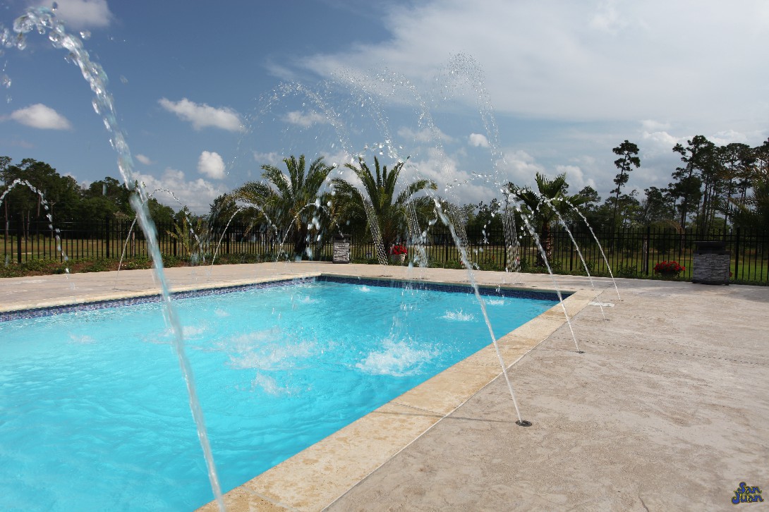 luxor deep fiberglass pool with raised tile wall and deck jets