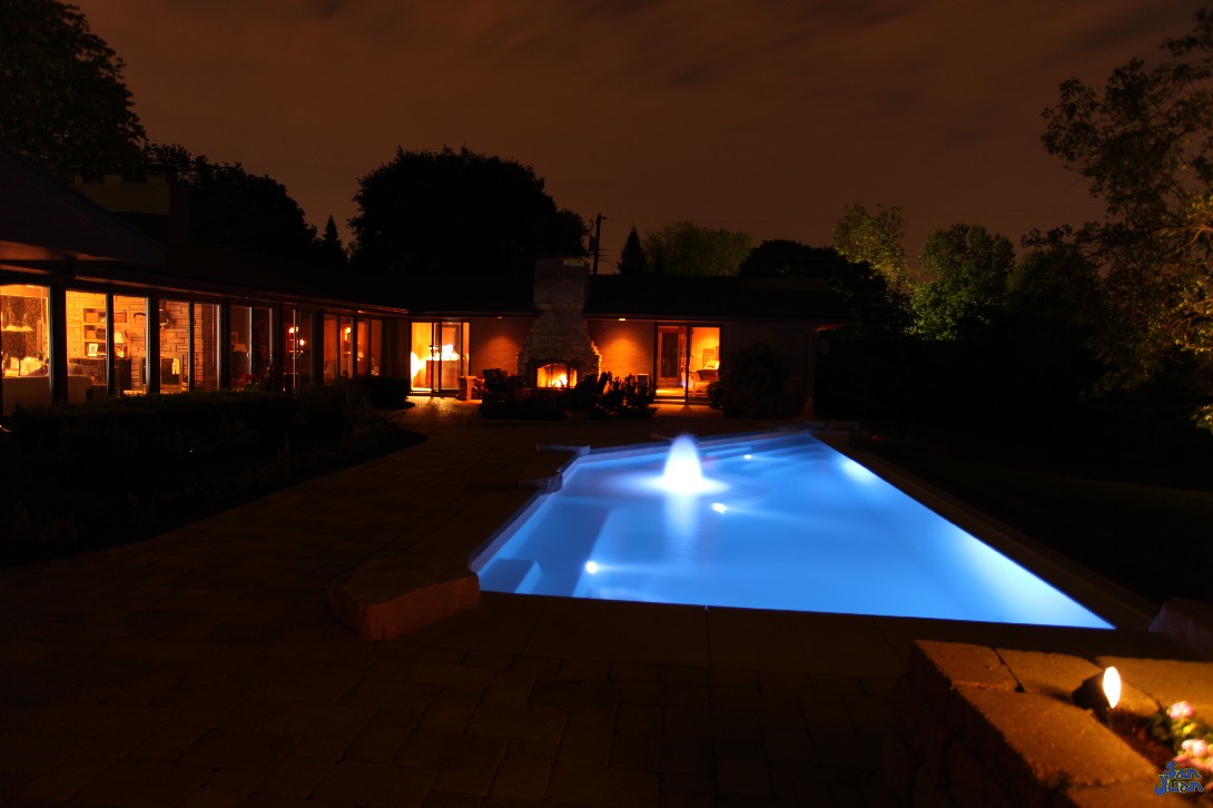 Harnessing the power of LED technology, we are able to create some amazing and unique images of our swimming pools. The iPool is a gorgeous combination of sharp-cut corners, water features and and design. This image shows how elegantly this swimming pool sits in your backyard - adding to its overall beautiful and utilization!