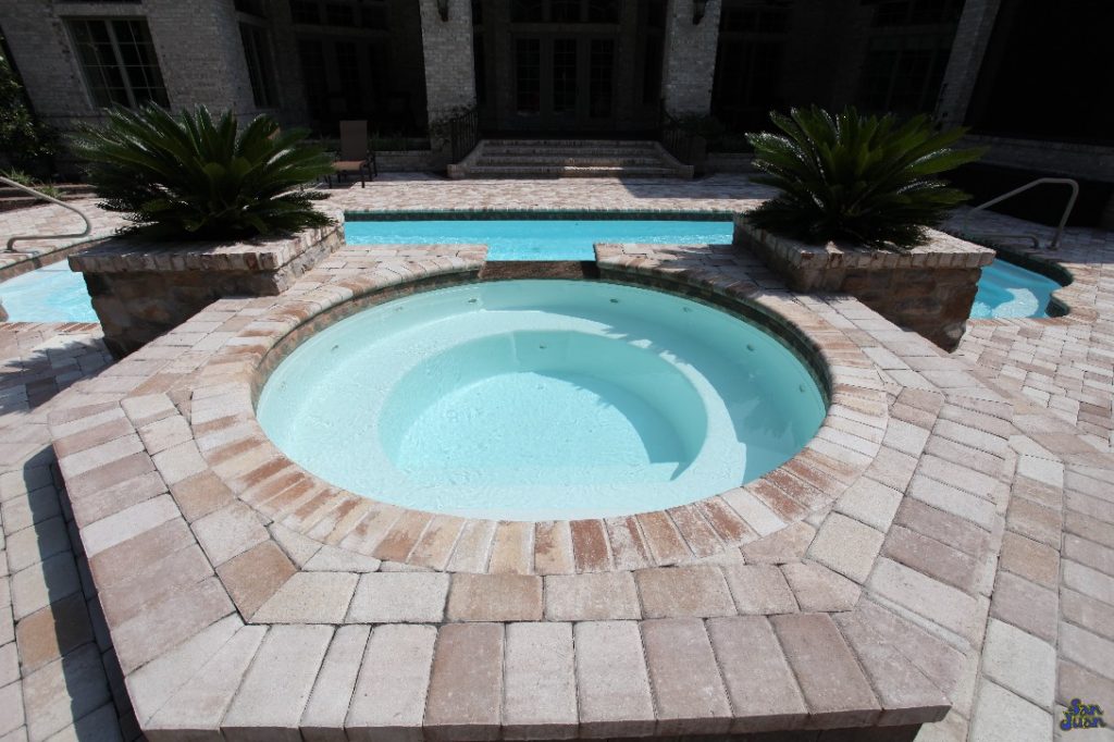 For all of our fiberglass pools, we have lots of added features that you can add on! In this example, this Phoenix Swimming Pool has an attached raised Spa to allow it's swimmers to heat up on a cool winter night. It's also another great place to gather for a relaxing evening with your favorite cocktail!