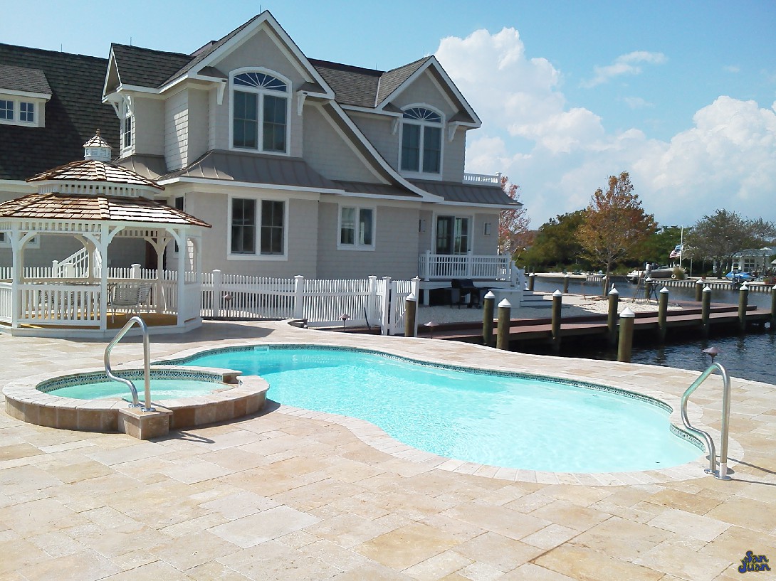 This Rio fiberglass pool is showcased in the Sully Blue gel coat. We have four fabulous color selections to choose from. All of them are designed from the most popular gel coats in the industry. The Sully Blue fits this pool shell perfectly due to the ivory travertine deck that accompanies it. 