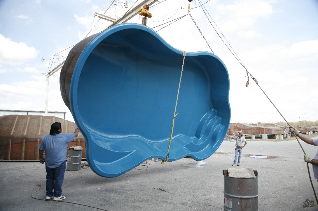 Our fiberglass shells are ready to ship from our factory! These pools are created from molds that routinely inspected and approved prior to each reuse. The manufacturing process only takes 1-2 days to complete and once the pool is thoroughly inspected, we are ready to ship it. This image shows our Rio pool being lifted and raised onto a semi-truck bound to another excited customer!