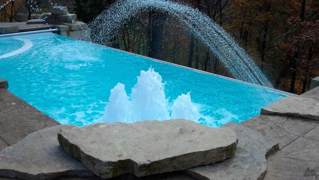 The iPool 2 is another modern-tech swimming pool. This swimming pool is designed to be paired with water features & advanced technology to create a fun & sophisticated look. We love this swimming pool because of all of the features that it offers. It easily outpaces your standard gunite swimming pool at a price that you will love!