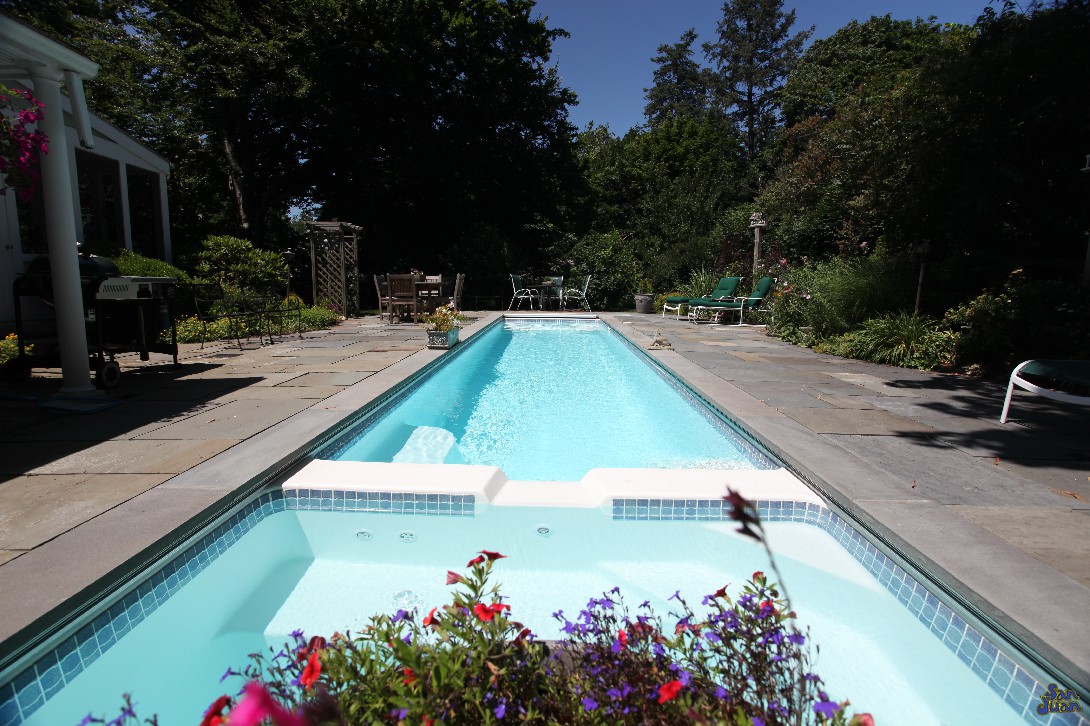 The Marathon also has an option to pair an attached spa. Adding a spa to your fiberglass pool really boosts the amount of swim time throughout the year. During cooler months of Fall & Winter, having the ability to hop in for warm up is a great feature and one that our customers love about our fiberglass shells!