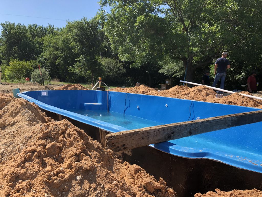 We are hard at work installing a new Hawaiian fiberglass pool in McKinney TX! This fiberglass shell was delivered with good timing! We are expecting our installation of this new fiberglass pool to complete the day before July 4th. Party time!