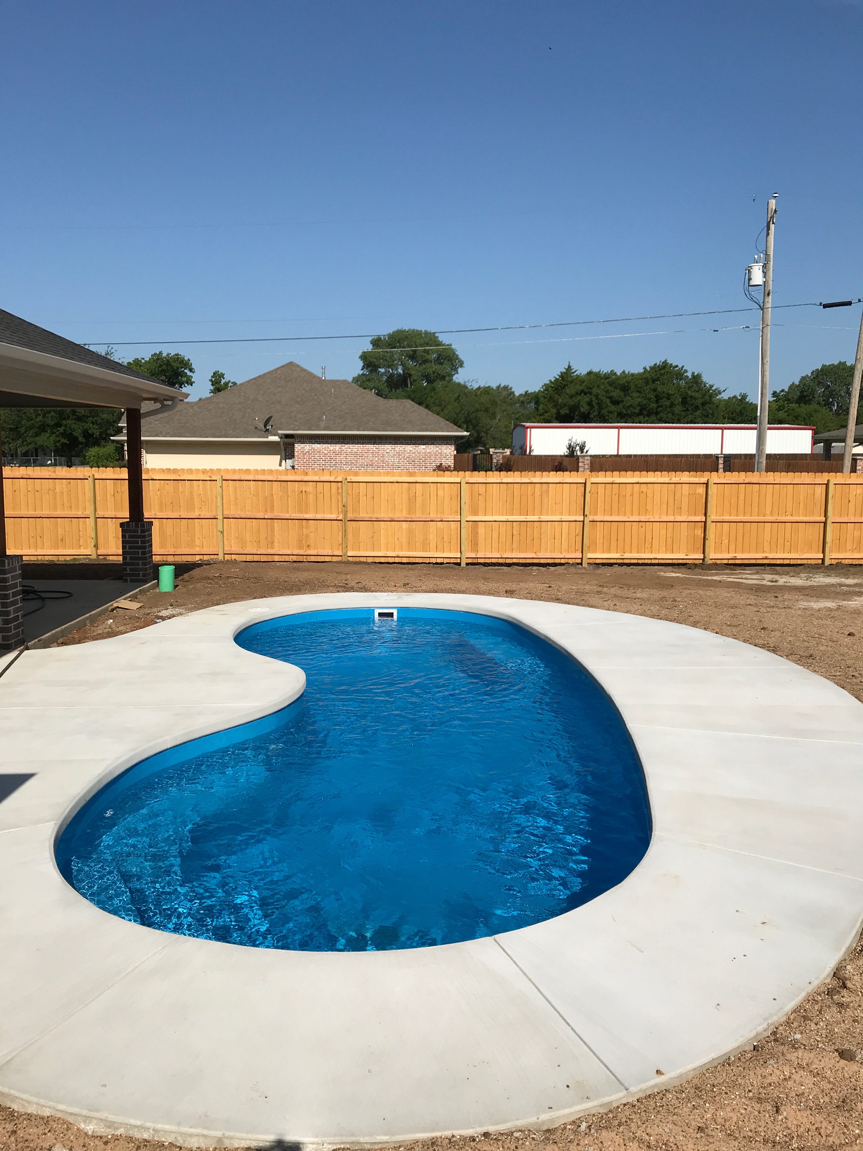 A poured concrete deck is an excellent complimentary tool to any fiberglass pool installation. We utilize "Stegmeier Deck Forms" to set a border around our swimming pool. This border forms our concrete and provides a bracing to hold our went cement as it dries. This forms your "coping" area and typically takes on a straight edge form.