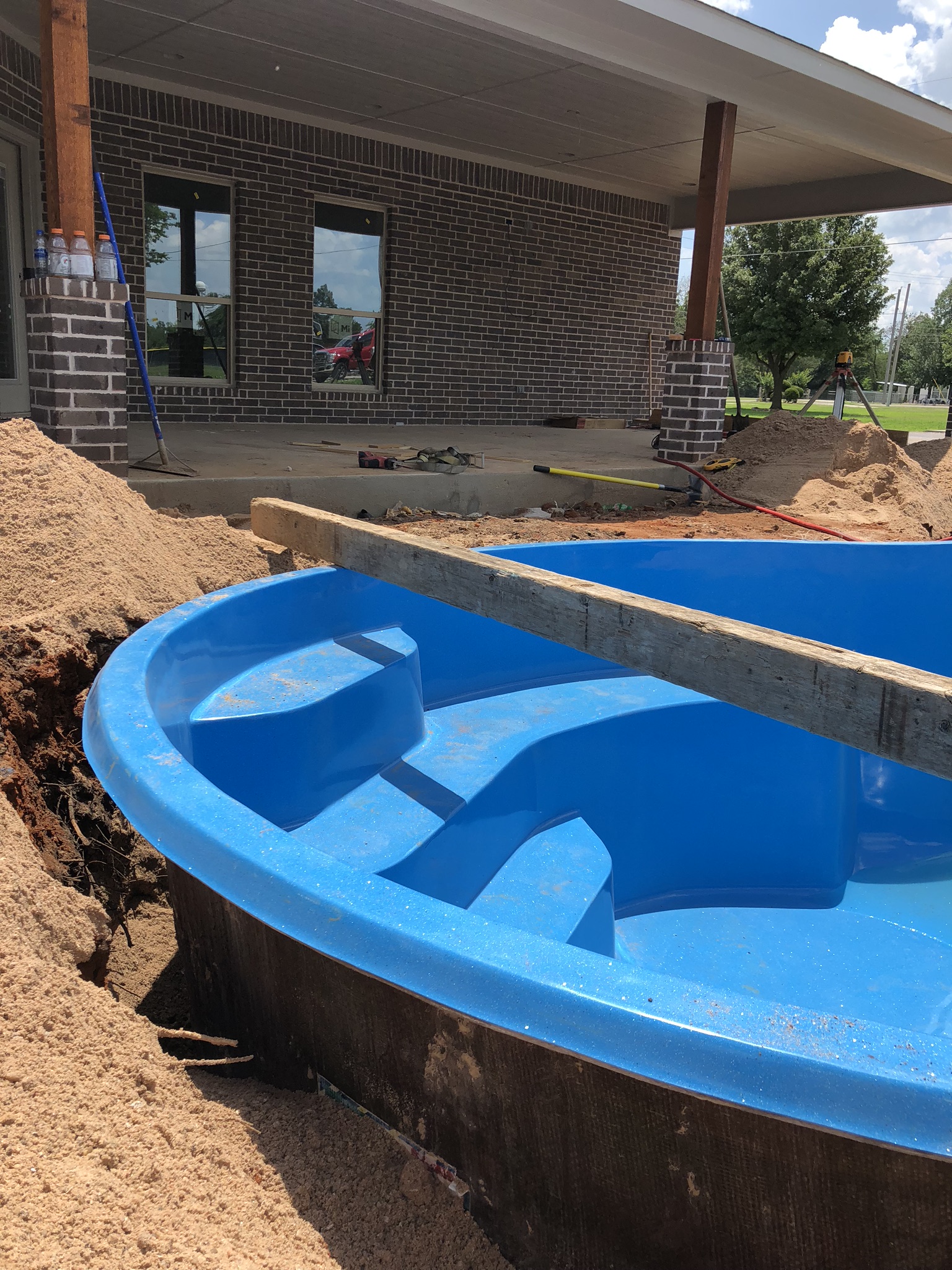 As you can see from this image, we "Over Dig" our swimming pool by about 6"-12". This allows our crews to properly set, ensure our pool is level and install our plumbing and electrical - once the pool is lowered into our hole. 