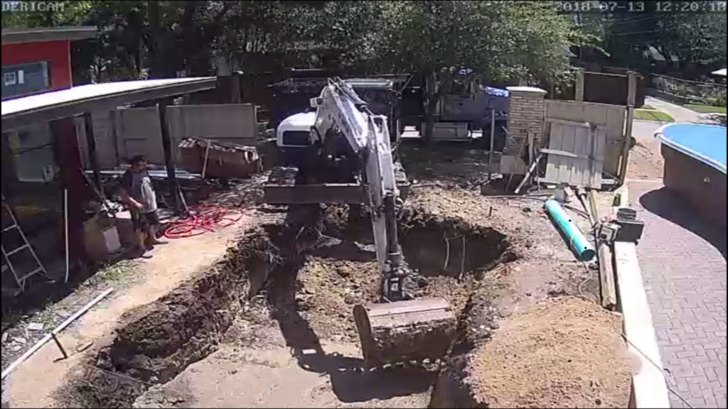 In order to set our swimming pool, we first have to remove some dirt. This image is taken as a snap shot of a time lapse - more to come on that later. Here you can see our excavator removing our natural soil to match the exact shape and dimensions of our swimming pool. 