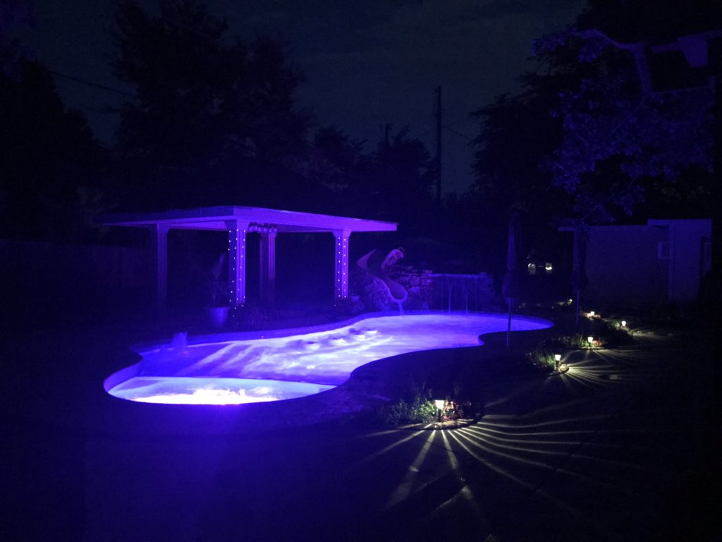 Dazzling, isn't it? This Pleasure Island fiberglass pool is absolutely stunning at night! We paired the pool with the Pentair Globrite LED Lights & an Easytouch Automation system for complete palm-of-your-hand control experience!