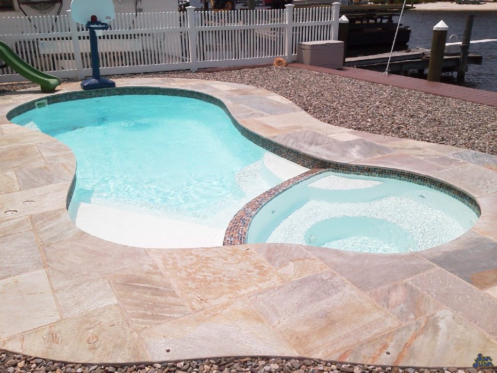 Here you can see the beautiful opacity of the pool water paired elegantly with the White gel coat offered by San Juan Pools! This creates a natural water tone that is both tropical and soothing for the soul!