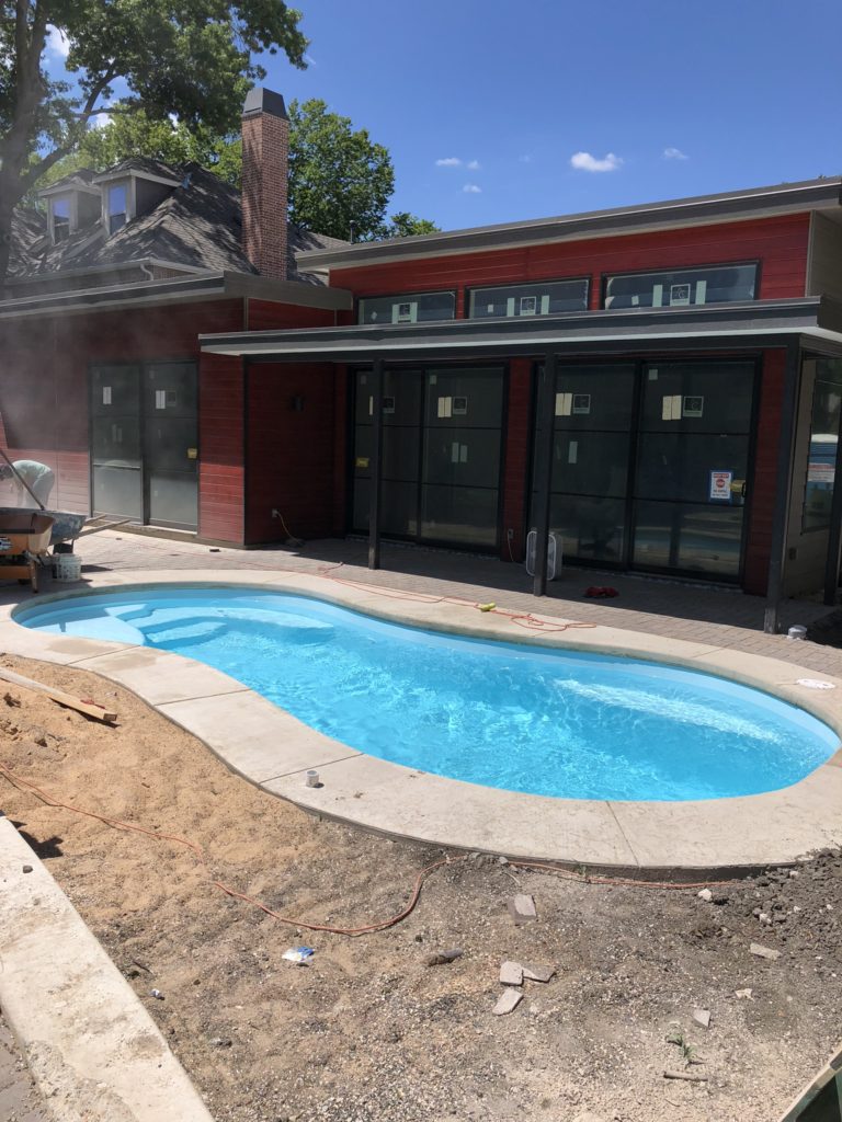 This home is currently under a home and backyard renovation process. We were able to complete our installation despite all of the work going on around us. Believe it or not, we finished our installation ahead of all of the other crews. Now our home owners can relax and enjoy the cool and crisp comfort of their Sundial fiberglass swimming pool!