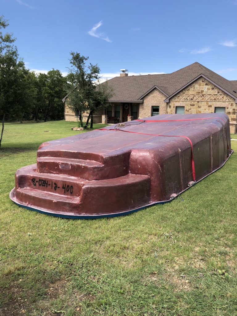 We are finishing up on the installation of the Savannah Shallow End model - located in Springtown TX. Here you can see our fiberglass pool shell in the front yard of our home owner. We just offloaded this pool shell from our delivery truck and are working on the excavation to set this fiberglass pool. 