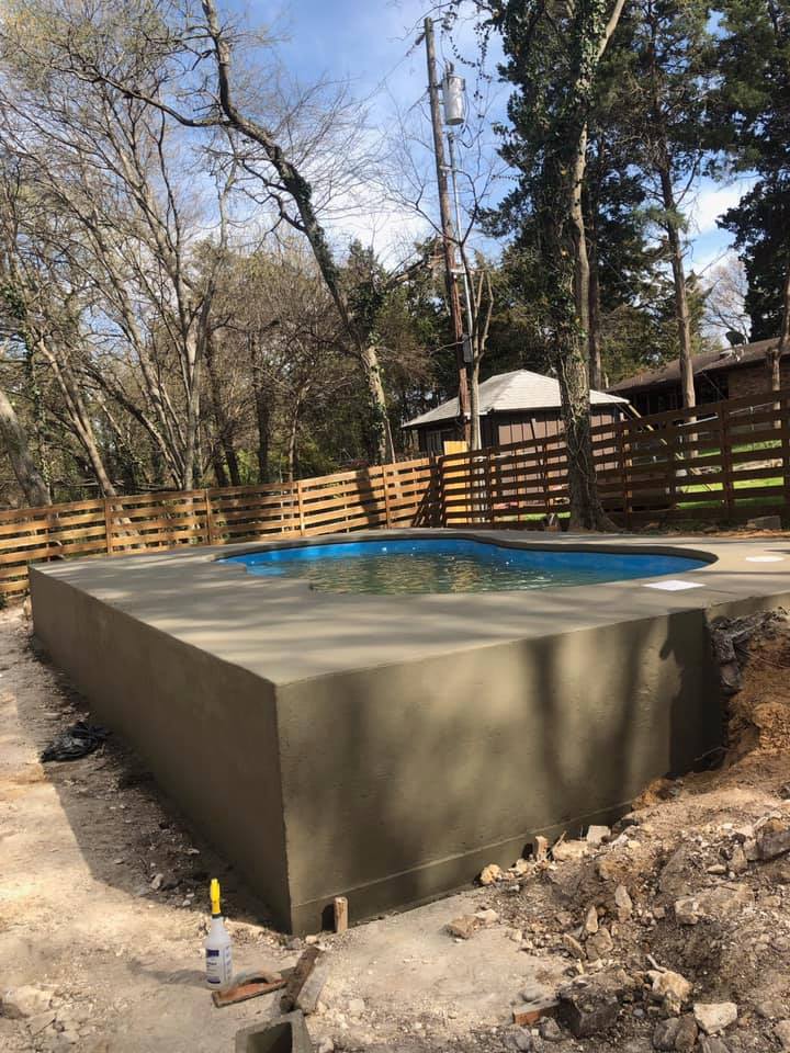 Our teams literally had to create a concrete box to hold this fiberglass pool in place. This was the safest and most cost effective route to install this beautiful pool for this very happy home owner! 