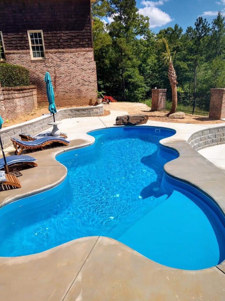 The Desert Falls is a relaxing, free form swimming pool with a wide tanning ledge and lots of curves! This fiberglass swimming pool provides the user with an overall length of 28' 9.75" and width of 12' 11". Tucked snugly into any Medium Sized backyard, this swimming pool is sure to provide hours of fun for any swim session or backyard event!