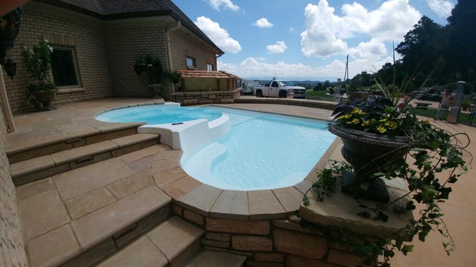 Here you can see the different levels that the Fun Deck provides. The fiberglass spa is elevate above the tanning ledge - and provides spillover effect into the tanning ledge basin. 